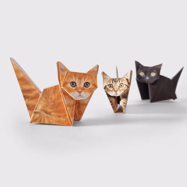 three close up origami cats close up